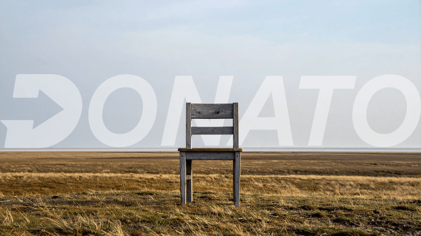 Empty chair in a field representing the hidden cost of an unfilled tech role on business productivity